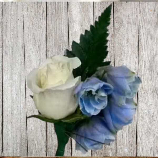 White and blue rose boutonniere with a dark green leaf