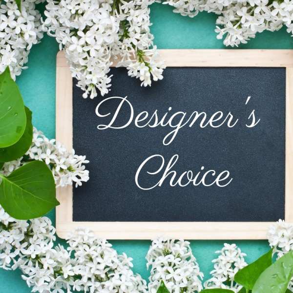Framed sign reading Designer's Choice surrounded by white flowers