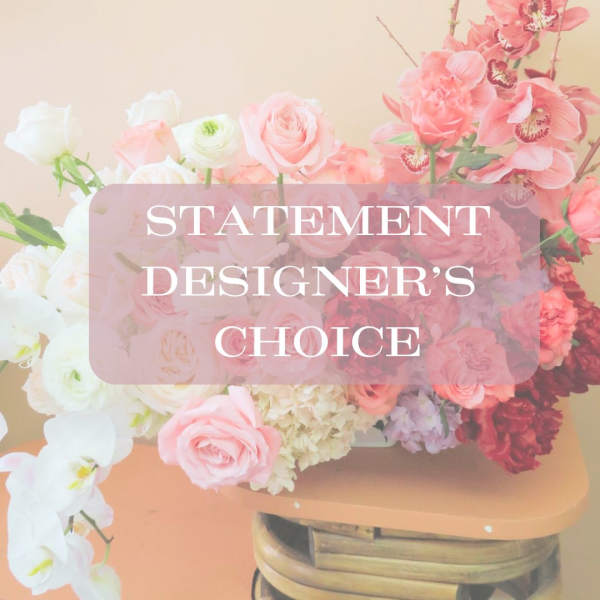 Pink and white floral arrangement with roses and orchids