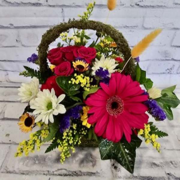 Mixed flower basket with roses, gerbera daisies, and chrysanthemums