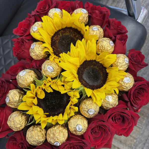 Bouquet of red roses, sunflowers, and gold-wrapped chocolates
