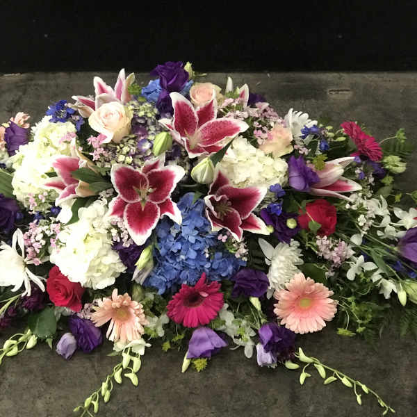 Large mixed floral spray with lilies, roses, hydrangeas, and gerbera daisies