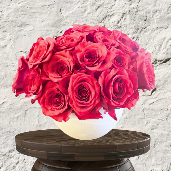 Bouquet of red roses in a white vase