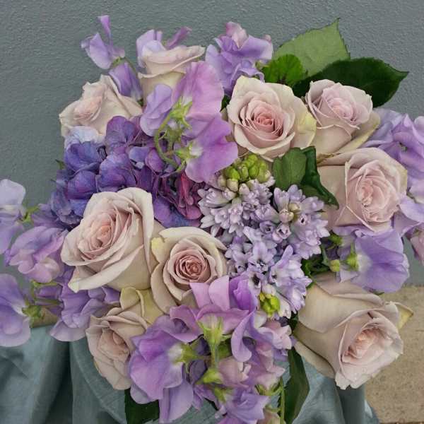 Bouquet of pale pink roses and lavender flowers