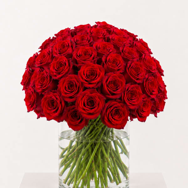 Large bouquet of red roses in a clear glass vase