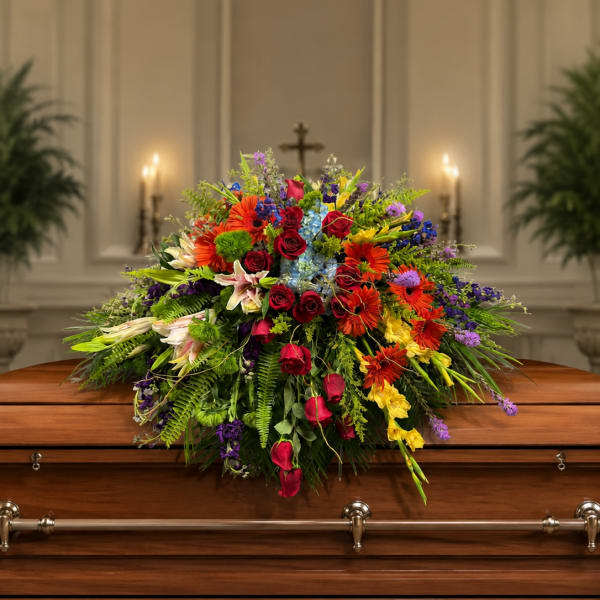 Renoir’s Touch of Vibrancy Casket Piece by Petal Perfection Flower Company