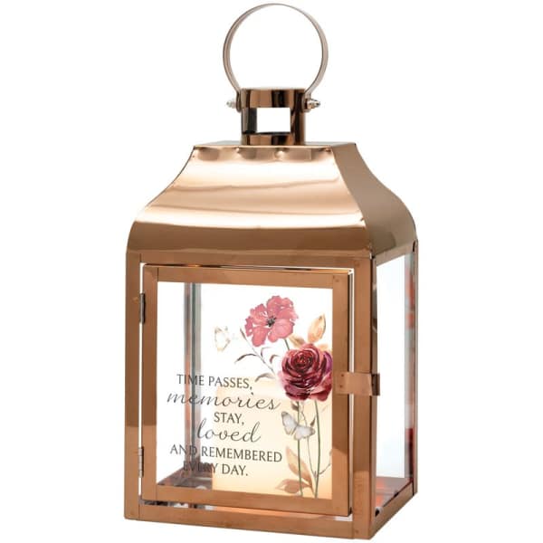 Copper lantern with a floral memorial quote inside