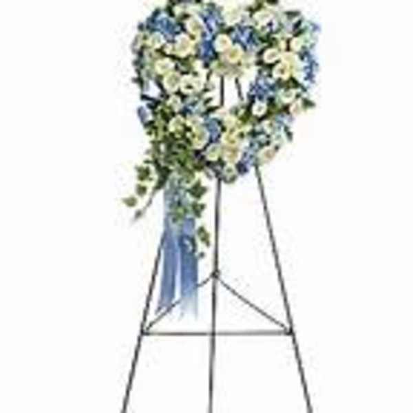 Blue and white floral standing spray on an easel