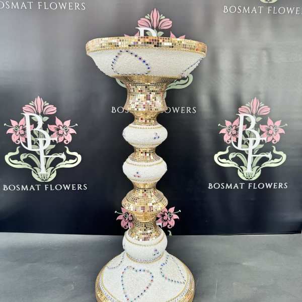 Tall gold-and-white mosaic pedestal vase with jeweled heart accents