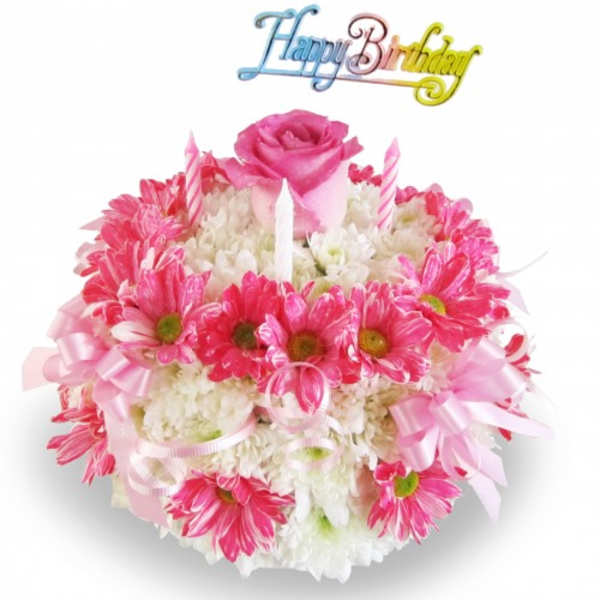 Pink and white flower arrangement with a rose topper and birthday sign