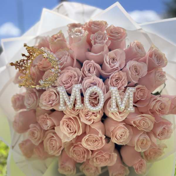 Pink rose bouquet with a jeweled crown and MOM decoration