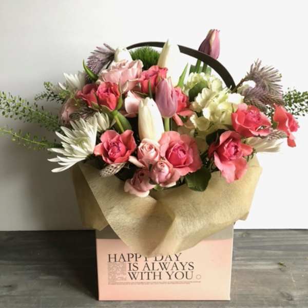Pink and white mixed flower bouquet in a gift box