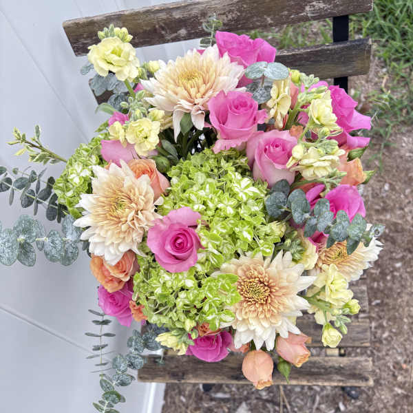Bouquet of pink roses, cream dahlias, and green hydrangeas