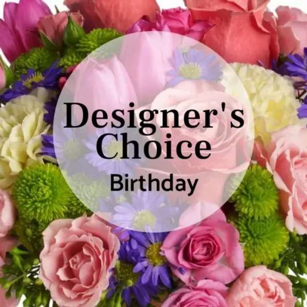 Mixed pink and purple flowers with a birthday label