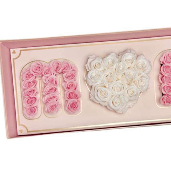 Pink and white roses arranged in a framed heart design with the word MOM.