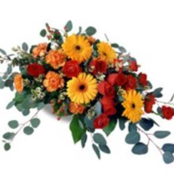 Mixed bouquet of yellow gerbera daisies and red-orange flowers
