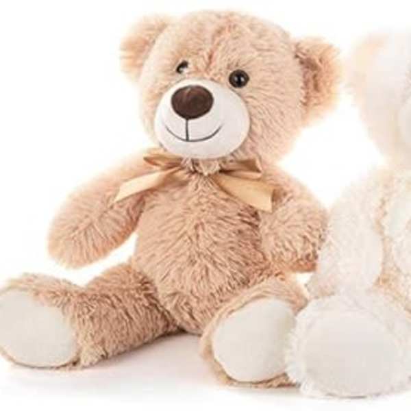 Three plush teddy bears in beige, white, and brown with bows