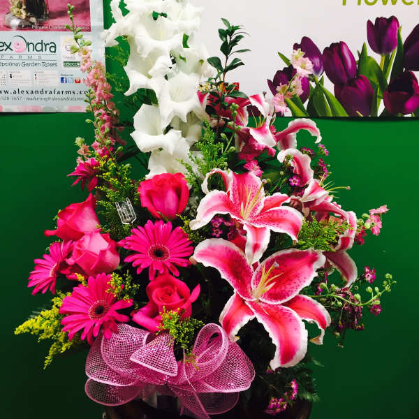Pink and white mixed flower arrangement with lilies, roses, and gerbera daisies