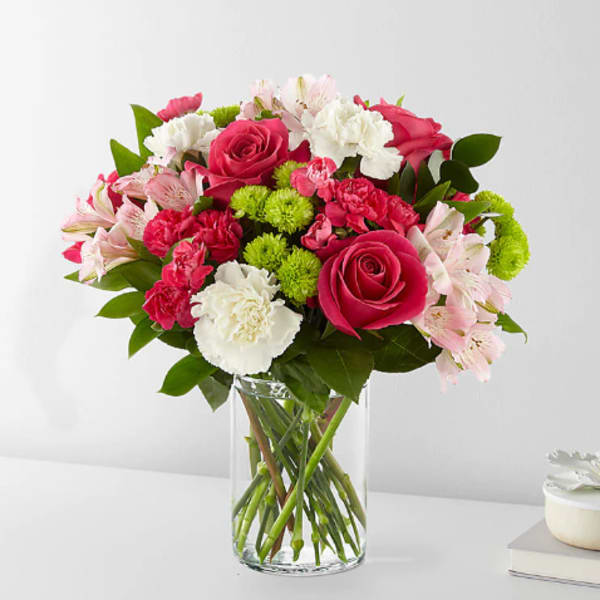 Pink and white mixed bouquet in a clear glass vase