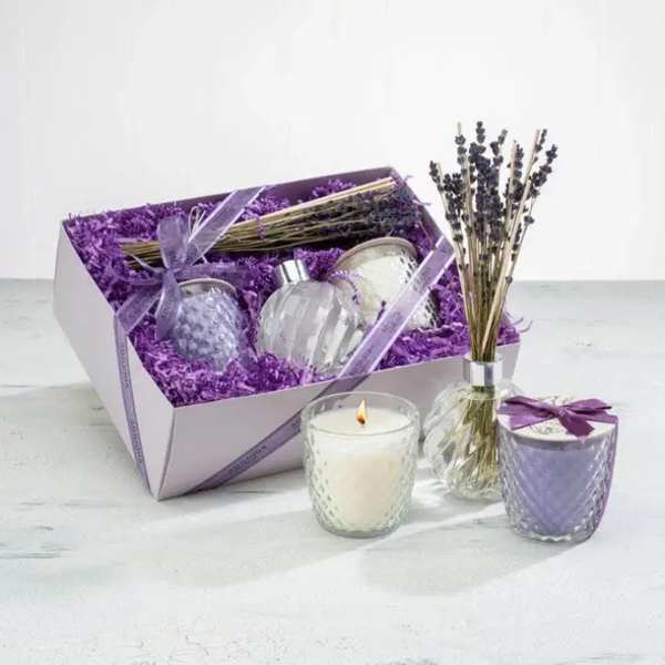 Lavender gift set with candles, perfume bottles, and dried lavender in a box