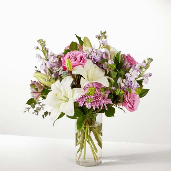Pink and white mixed bouquet in a clear glass vase