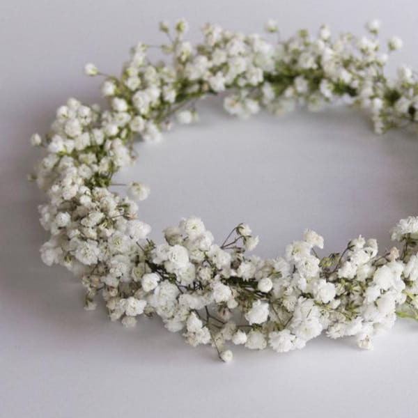 White baby's breath flower crown on a plain background