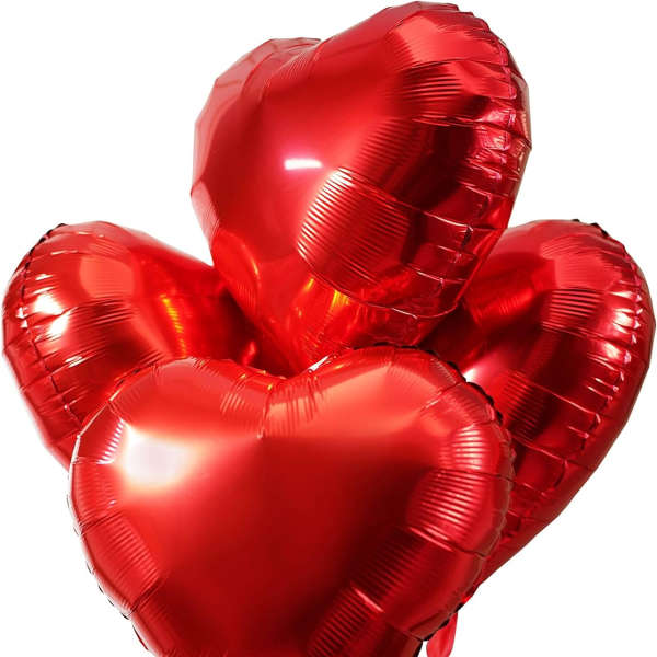 Cluster of red heart-shaped balloons on strings