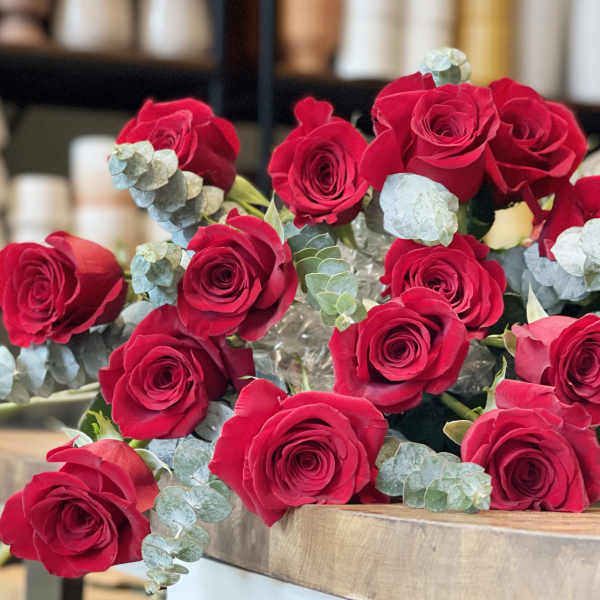Bouquet of red roses with pale blue eucalyptus