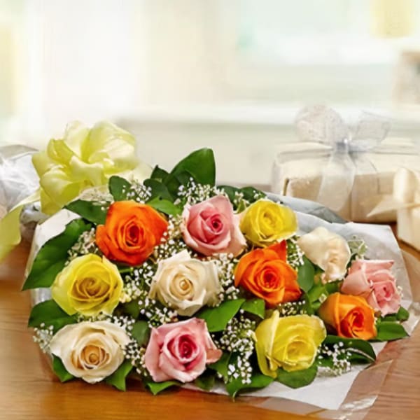 Bouquet of multicolored roses wrapped in paper