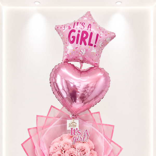 Pink baby shower bouquet with a star balloon, heart balloon, and roses