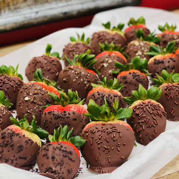 Tray of chocolate-covered strawberries with sprinkles