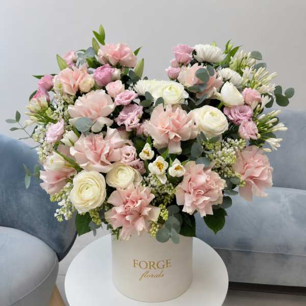 Pink and white mixed bouquet in a cream hat box