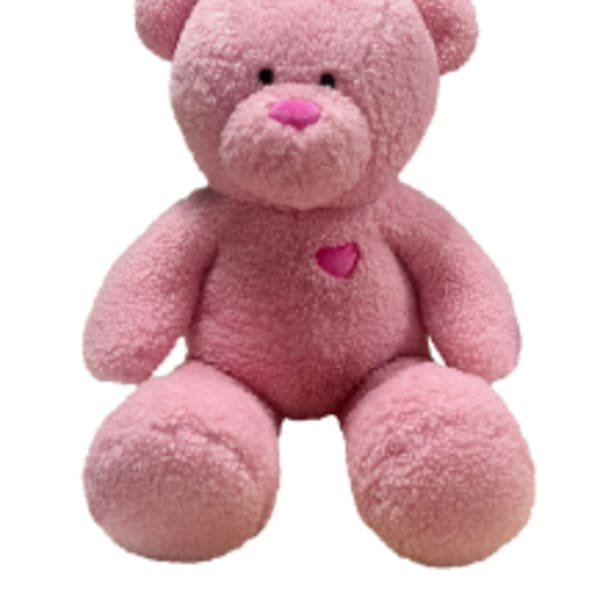Pink teddy bear plush toy with a heart on its chest