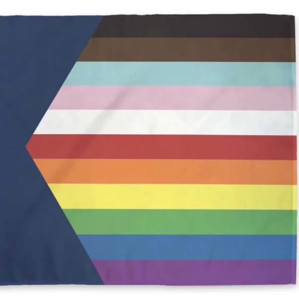 Rainbow-striped flag with a white star on a dark blue field
