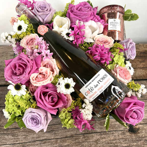 Bouquet with roses and a wine bottle, plus a rose-scented candle