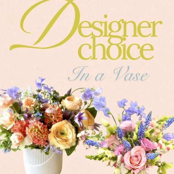 Two colorful flower arrangements in white vases against a pink background