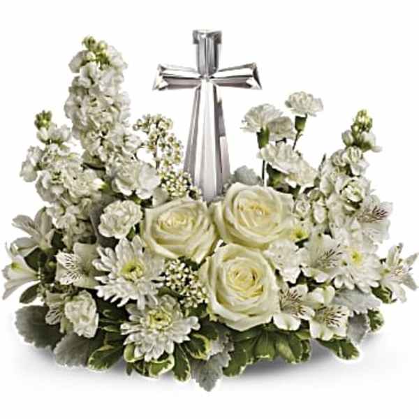 White floral wreath with a silver cross in the center