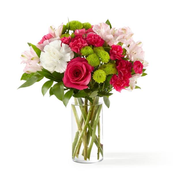 Bouquet of pink and white flowers in a clear glass vase