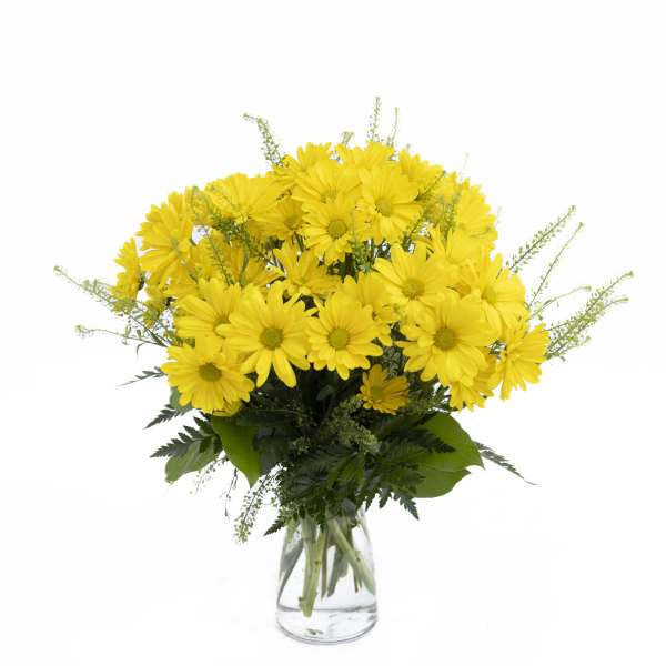 Yellow daisy bouquet in a clear glass vase