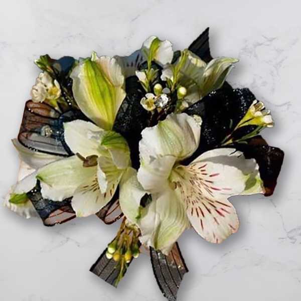 White and pale green flower bouquet with dark ribbon accents