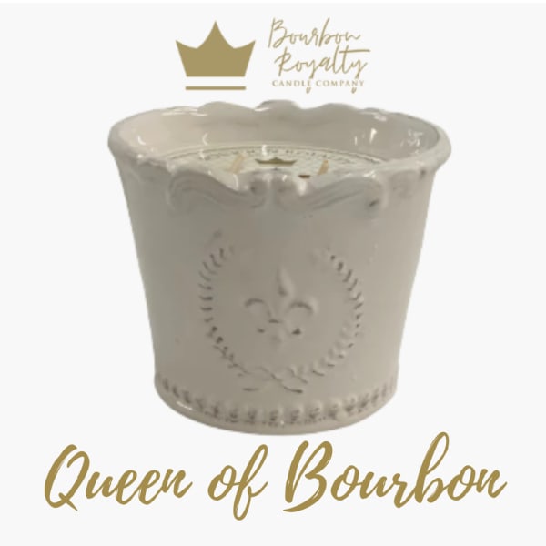 Cream ceramic candle jar with gold logo and text