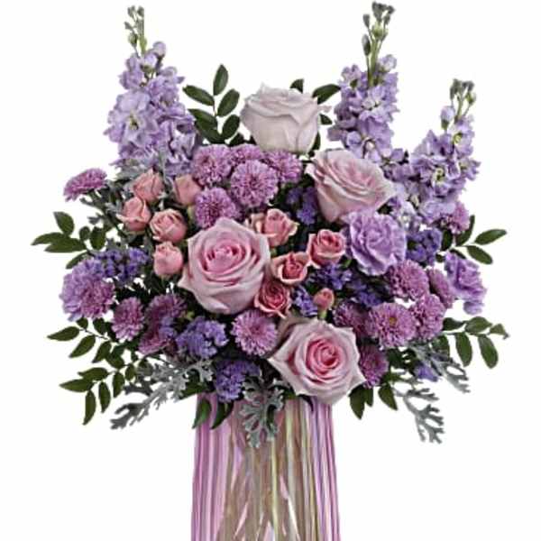 Pink and lavender bouquet in a ribbed glass vase