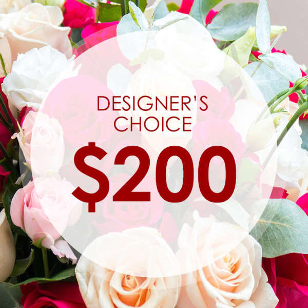 Mixed bouquet of white, pink, and peach roses with a $200 designer's choice label