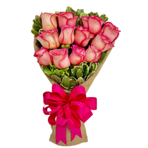 Bouquet of pink roses wrapped in burlap with a bright pink ribbon