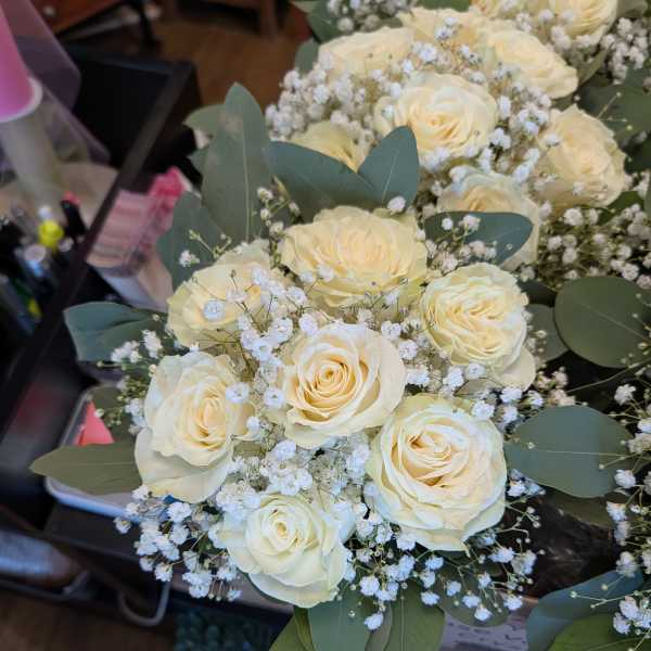 Bouquet of cream roses with baby's breath and eucalyptus