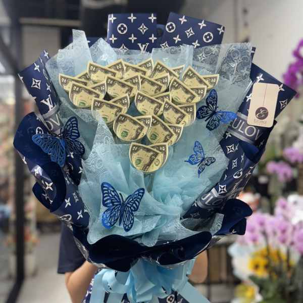 Blue gift bouquet with dollar-bill accents and butterfly decorations