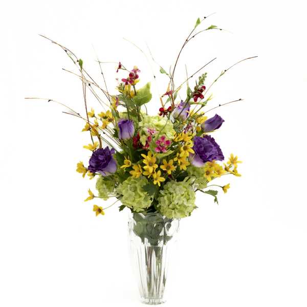 Purple and yellow mixed bouquet in a clear glass vase