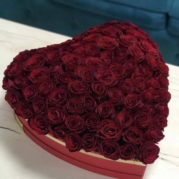Heart-shaped box filled with red roses