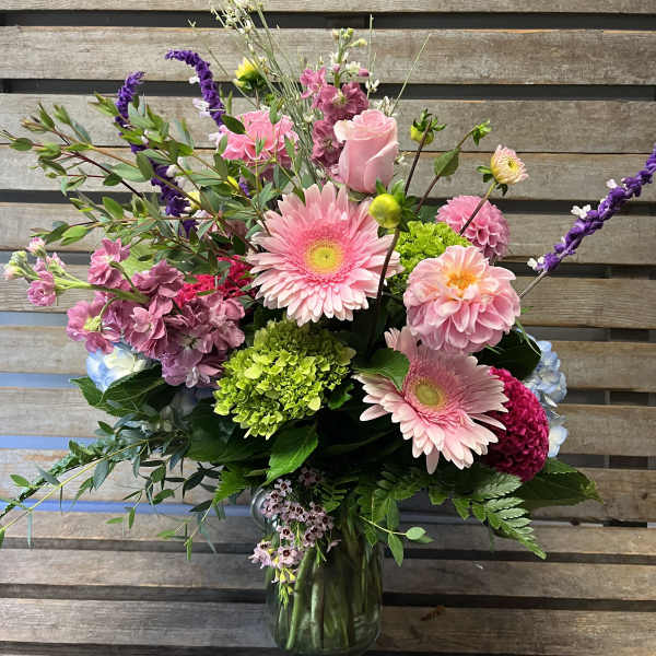 Pink and purple mixed bouquet in a glass vase