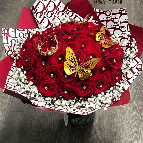 Red rose bouquet with white baby's breath and gold butterfly accents